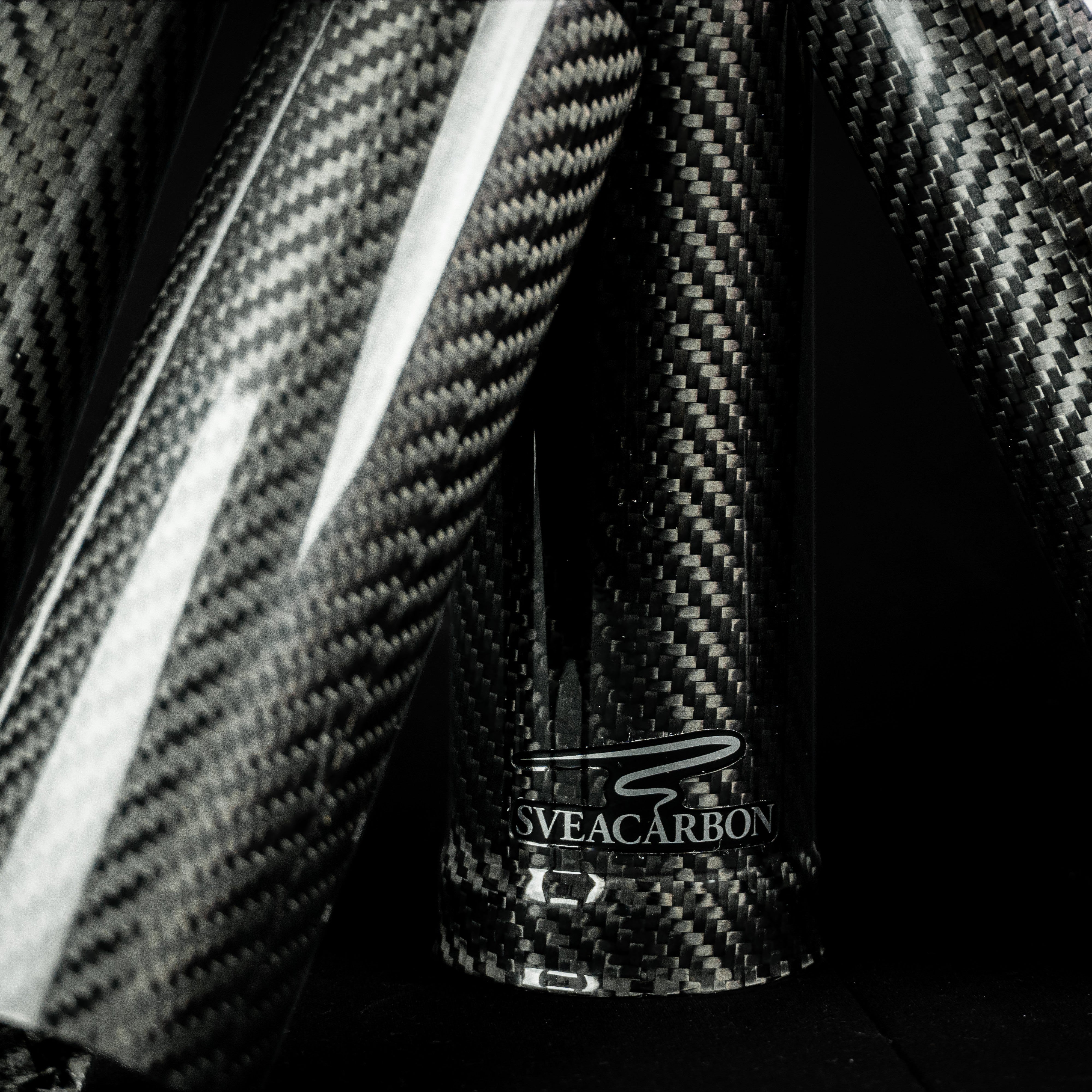 Full-length carbon fork covers leaning together – glossy 2x2 twill