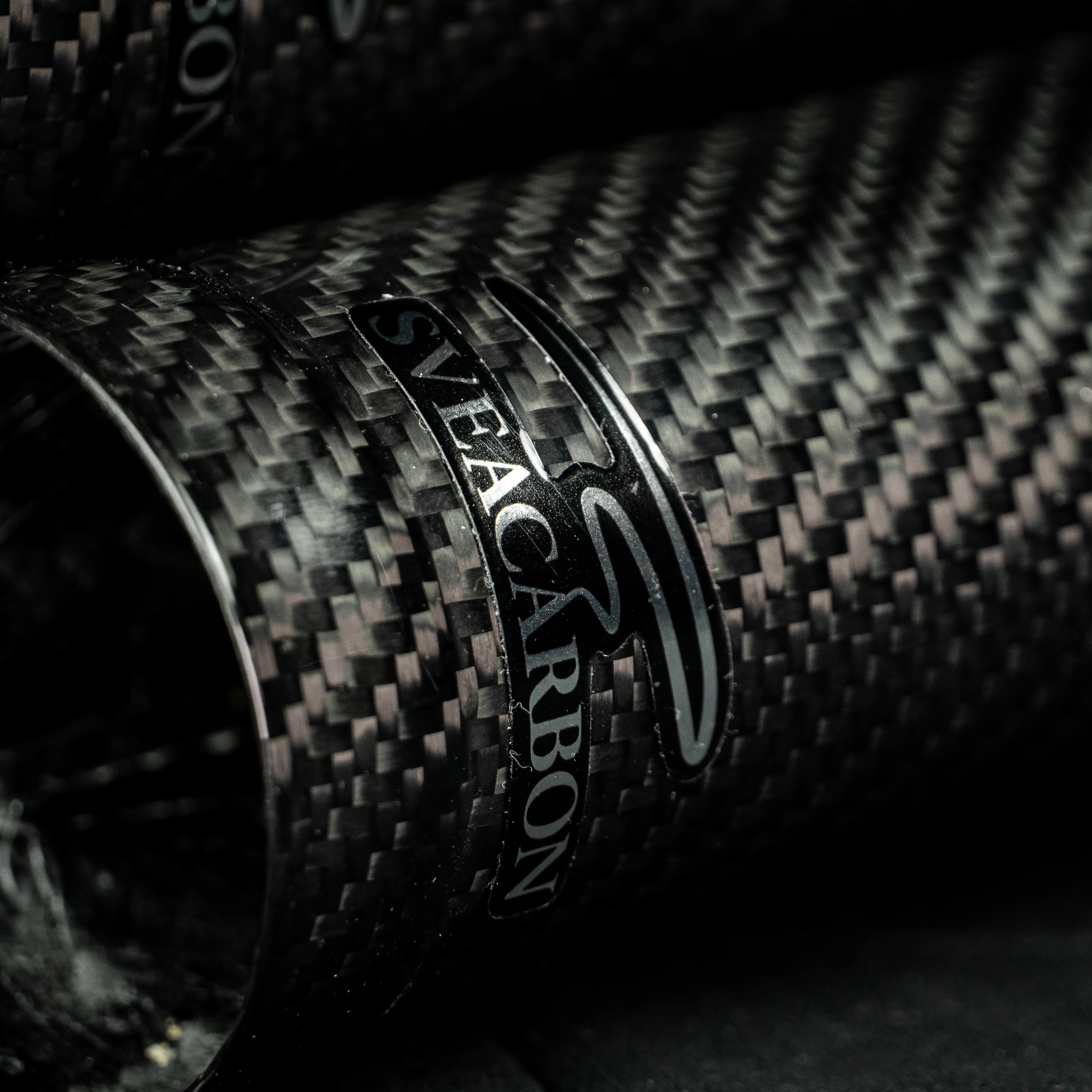 Sveacarbon logo detail on a full-length carbon fibre fork cover