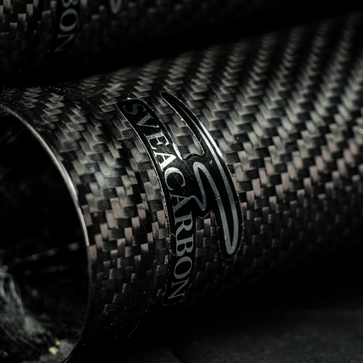 Sveacarbon logo detail on a full-length carbon fibre fork cover