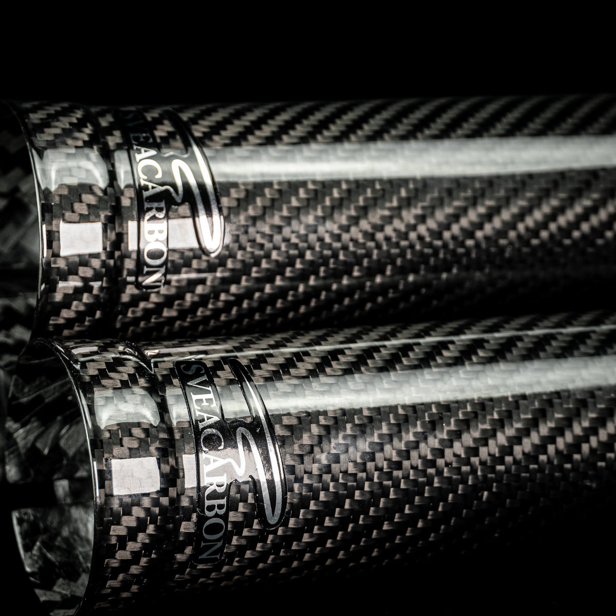 Full-length carbon fork cover ends with Sveacarbon logo caps